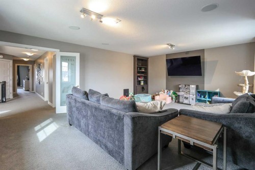 112 Eastpointe Drive, Blackfalds, AB - Indoor Photo Showing Living Room With Fireplace