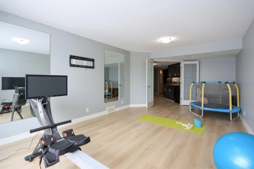 112 Eastpointe Drive, Blackfalds, AB - Indoor Photo Showing Gym Room
