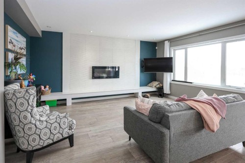 112 Eastpointe Drive, Blackfalds, AB - Indoor Photo Showing Living Room With Fireplace