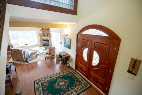 36067-42 Range Road Range, Rural Red Deer County, AB - Indoor Photo Showing Other Room With Fireplace
