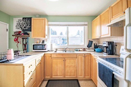 5903 56 Avenue, Red Deer, AB - Indoor Photo Showing Kitchen With Double Sink