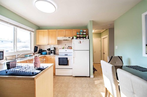 5903 56 Avenue, Red Deer, AB - Indoor Photo Showing Kitchen With Double Sink