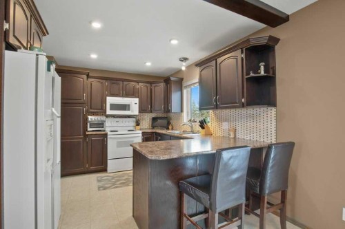 45 Ravenscrag Crescent, Norglenwold, AB - Indoor Photo Showing Kitchen With Double Sink