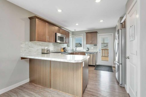 14 Cascade Street, Blackfalds, AB - Indoor Photo Showing Kitchen With Upgraded Kitchen