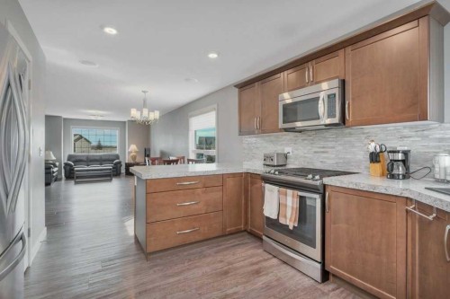 14 Cascade Street, Blackfalds, AB - Indoor Photo Showing Kitchen With Upgraded Kitchen