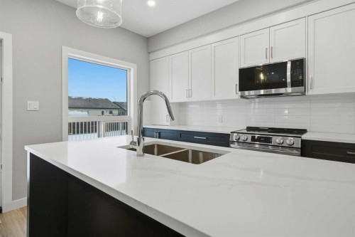 70 Palmer Circle, Blackfalds, AB - Indoor Photo Showing Kitchen With Double Sink With Upgraded Kitchen