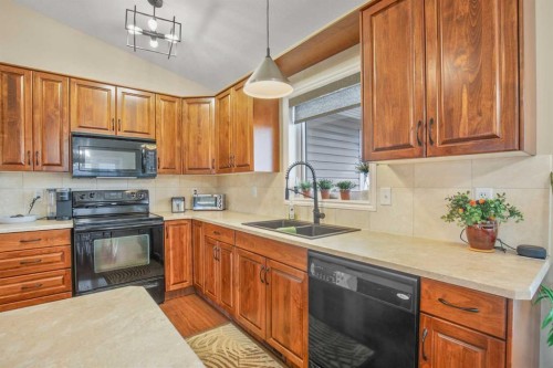 45 Emily Crescent, Lacombe, AB - Indoor Photo Showing Kitchen With Double Sink