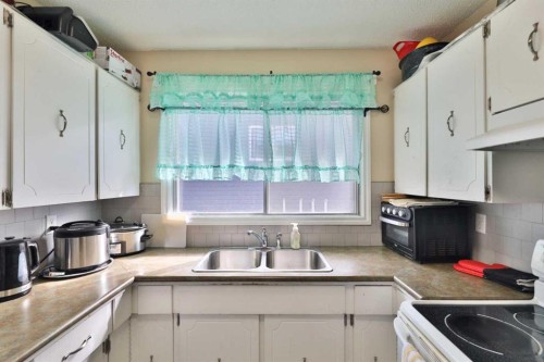 6403A 49 Avenue, Camrose, AB - Indoor Photo Showing Kitchen With Double Sink