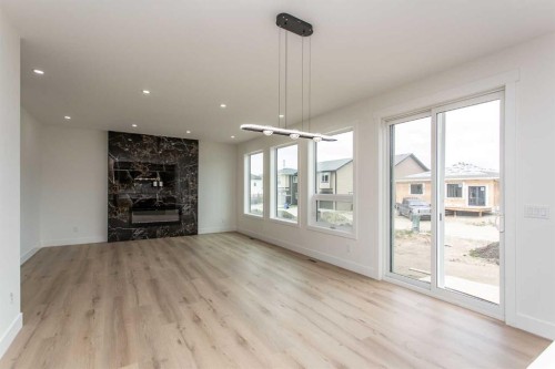 17 Thatcher Avenue, Red Deer, AB - Indoor Photo Showing Living Room With Fireplace