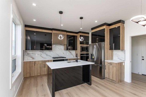 17 Thatcher Avenue, Red Deer, AB - Indoor Photo Showing Kitchen With Double Sink With Upgraded Kitchen