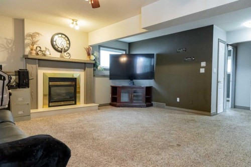 35 Kemp Avenue, Red Deer, AB - Indoor Photo Showing Living Room With Fireplace