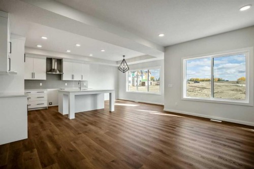 27 Heritage Link, Cochrane, AB - Indoor Photo Showing Kitchen With Upgraded Kitchen