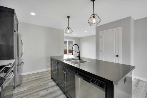 15 Iron Gate Boulevard, Sylvan Lake, AB - Indoor Photo Showing Kitchen With Double Sink