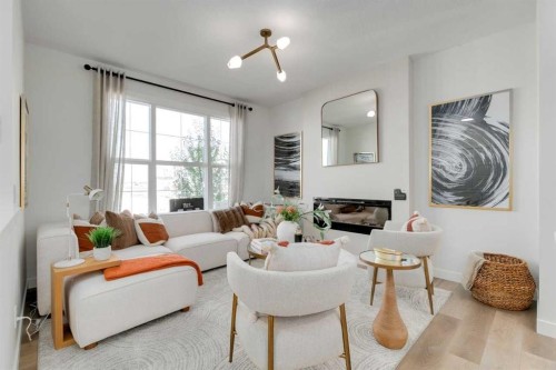 568 Buffaloberry Manor Se, Calgary, AB - Indoor Photo Showing Living Room With Fireplace