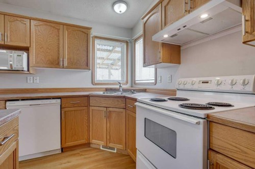 68 Herder Drive, Sylvan Lake, AB - Indoor Photo Showing Kitchen With Double Sink