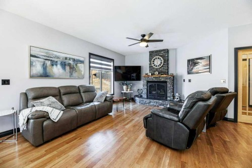 6 Cranna Place, Lacombe, AB - Indoor Photo Showing Living Room With Fireplace