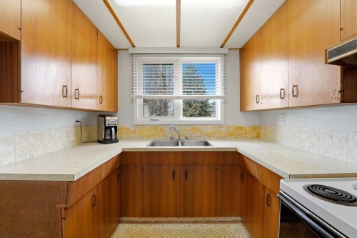 69 Wright Avenue, Red Deer, AB - Indoor Photo Showing Kitchen With Double Sink
