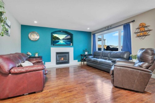 17 Coachill Street, Blackfalds, AB - Indoor Photo Showing Living Room With Fireplace