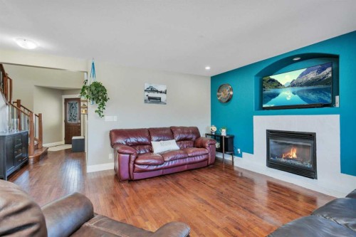 17 Coachill Street, Blackfalds, AB - Indoor Photo Showing Living Room With Fireplace