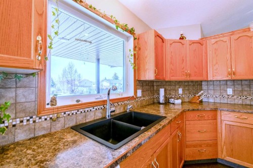 5404 49A Avenue, Alix, AB - Indoor Photo Showing Kitchen With Double Sink