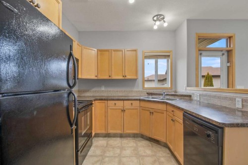 1 Ivey Close, Red Deer, AB - Indoor Photo Showing Kitchen With Double Sink