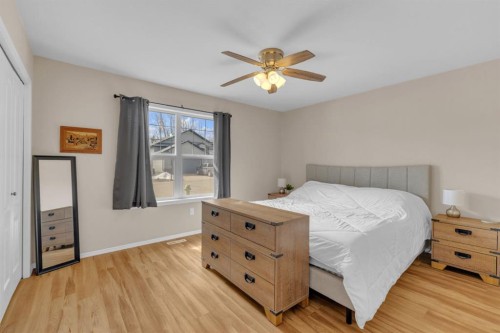 56 Wilkinson Circle, Sylvan Lake, AB - Indoor Photo Showing Bedroom