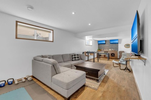 56 Wilkinson Circle, Sylvan Lake, AB - Indoor Photo Showing Living Room With Fireplace
