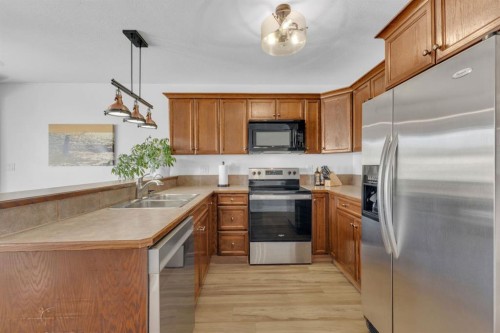 56 Wilkinson Circle, Sylvan Lake, AB - Indoor Photo Showing Kitchen With Double Sink