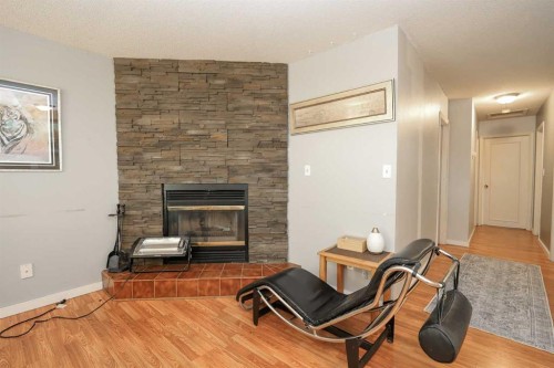 56 Elder Street, Red Deer, AB - Indoor Photo Showing Other Room With Fireplace