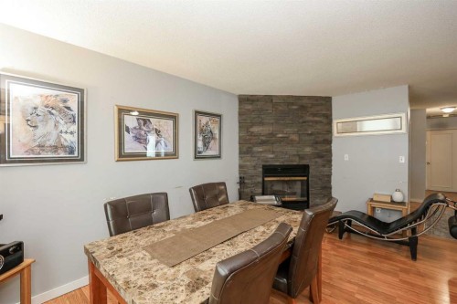 56 Elder Street, Red Deer, AB - Indoor Photo Showing Dining Room With Fireplace