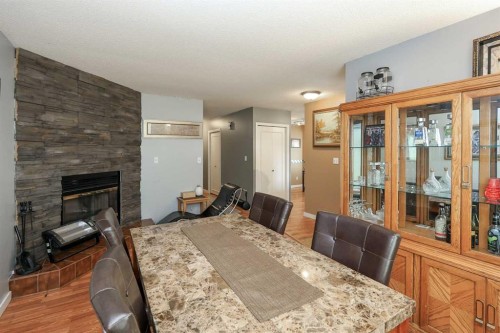 56 Elder Street, Red Deer, AB - Indoor Photo Showing Dining Room With Fireplace