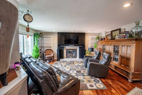 14 Eldridge Crescent, Red Deer, AB - Indoor Photo Showing Living Room With Fireplace