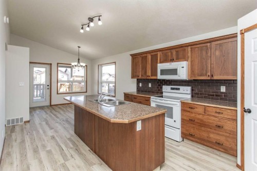 63 Vickers Close, Red Deer, AB - Indoor Photo Showing Kitchen With Double Sink