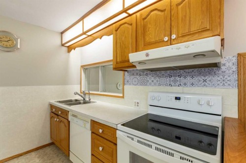 4108 49A Avenue, Innisfail, AB - Indoor Photo Showing Kitchen With Double Sink