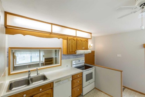 4108 49A Avenue, Innisfail, AB - Indoor Photo Showing Kitchen With Double Sink