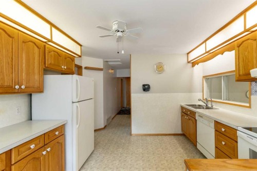4108 49A Avenue, Innisfail, AB - Indoor Photo Showing Kitchen With Double Sink