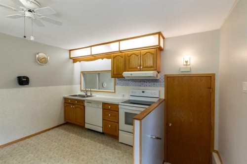 4108 49A Avenue, Innisfail, AB - Indoor Photo Showing Kitchen With Double Sink