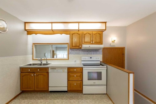 4108 49A Avenue, Innisfail, AB - Indoor Photo Showing Kitchen With Double Sink