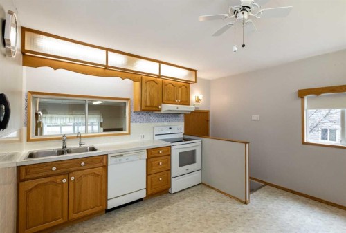 4108 49A Avenue, Innisfail, AB - Indoor Photo Showing Kitchen With Double Sink