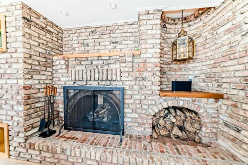 157 Grand Avenue, Norglenwold, AB - Indoor Photo Showing Living Room With Fireplace