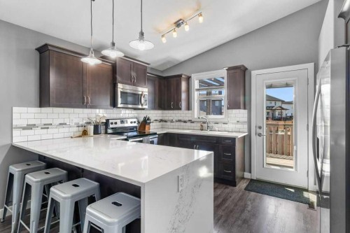 30 Brookstone Drive, Sylvan Lake, AB - Indoor Photo Showing Kitchen With Stainless Steel Kitchen With Double Sink With Upgraded Kitchen