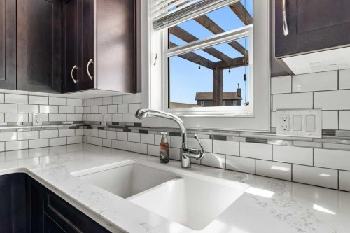 30 Brookstone Drive, Sylvan Lake, AB - Indoor Photo Showing Kitchen With Double Sink
