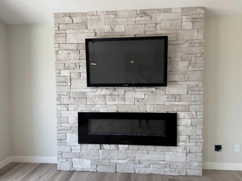 52 Emmett Crescent, Red Deer, AB - Indoor Photo Showing Living Room With Fireplace