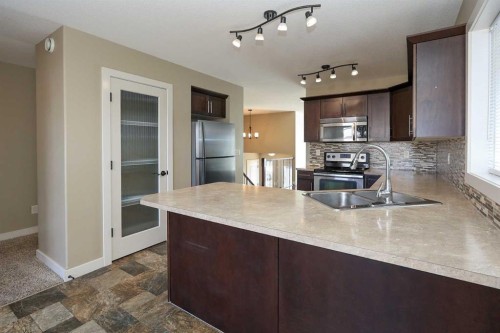 85 Cedar Crescent, Blackfalds, AB - Indoor Photo Showing Kitchen With Double Sink