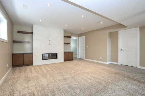 85 Cedar Crescent, Blackfalds, AB - Indoor Photo Showing Other Room With Fireplace