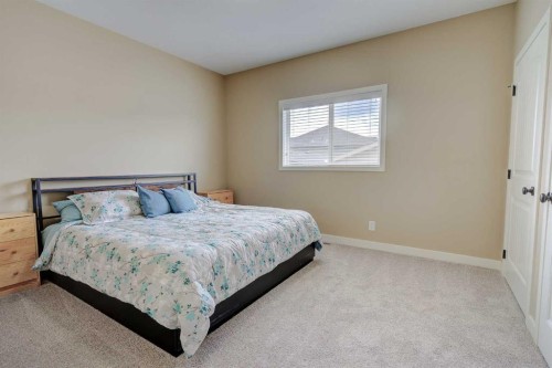 82 Harvest Close, Penhold, AB - Indoor Photo Showing Bedroom