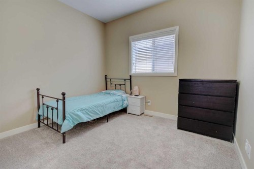82 Harvest Close, Penhold, AB - Indoor Photo Showing Bedroom
