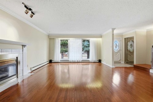 3919 43 Avenue, Red Deer, AB - Indoor Photo Showing Living Room With Fireplace