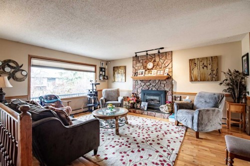 44 Norwest Close, Red Deer, AB - Indoor Photo Showing Living Room With Fireplace