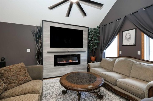 25 Kee Close, Red Deer, AB - Indoor Photo Showing Living Room With Fireplace